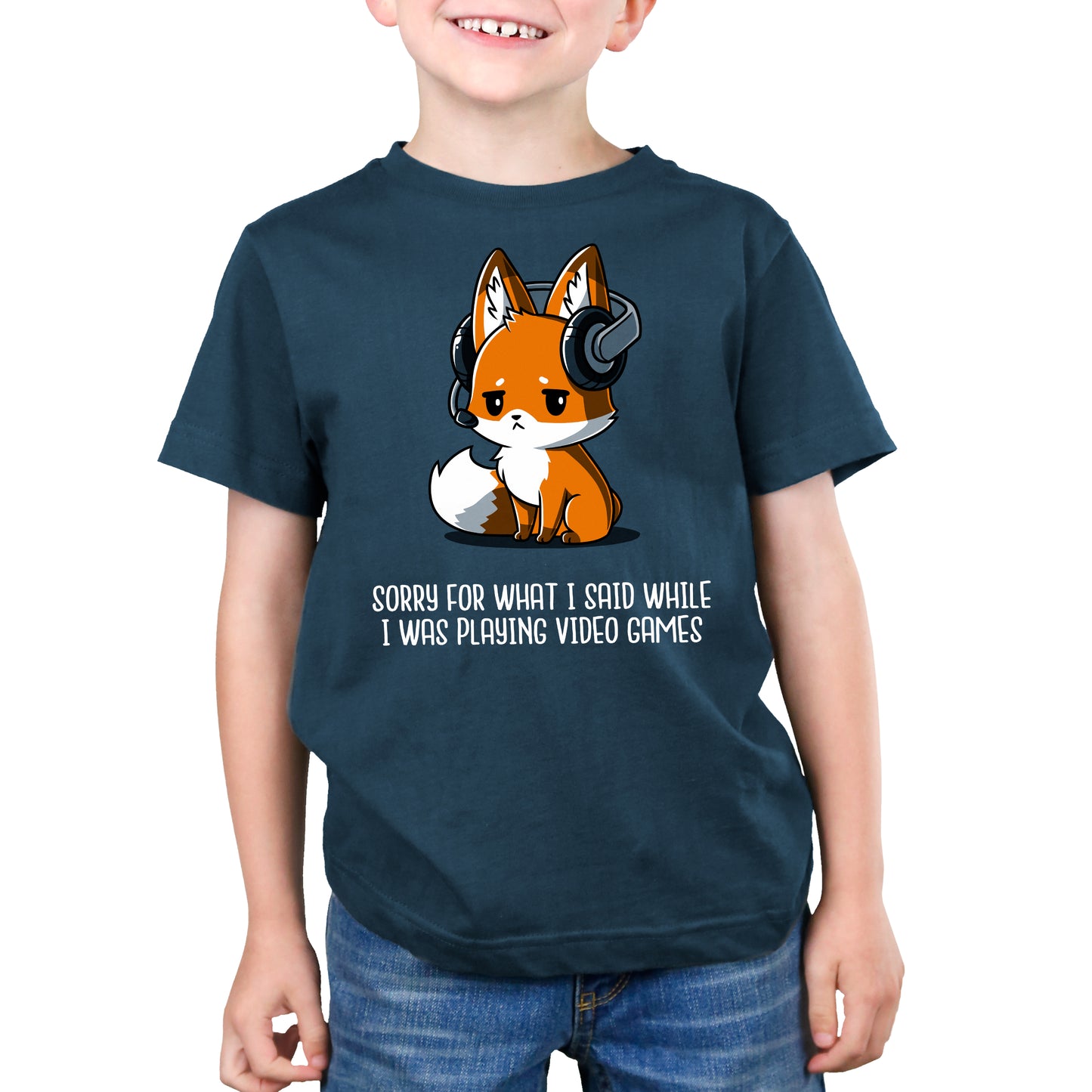 A young boy wearing a TeeTurtle "Sorry For What I Said" t-shirt while playing video games.
