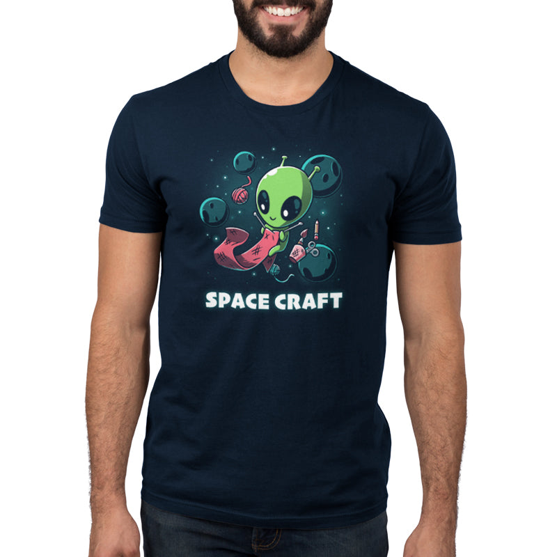 A man in a navy blue TeeTurtle t-shirt featuring the Space Craft.