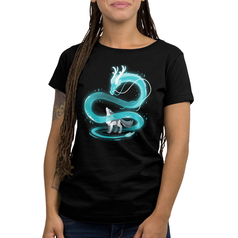 A woman wearing a black t-shirt with the Spirit of the Moon dragon on it from TeeTurtle.