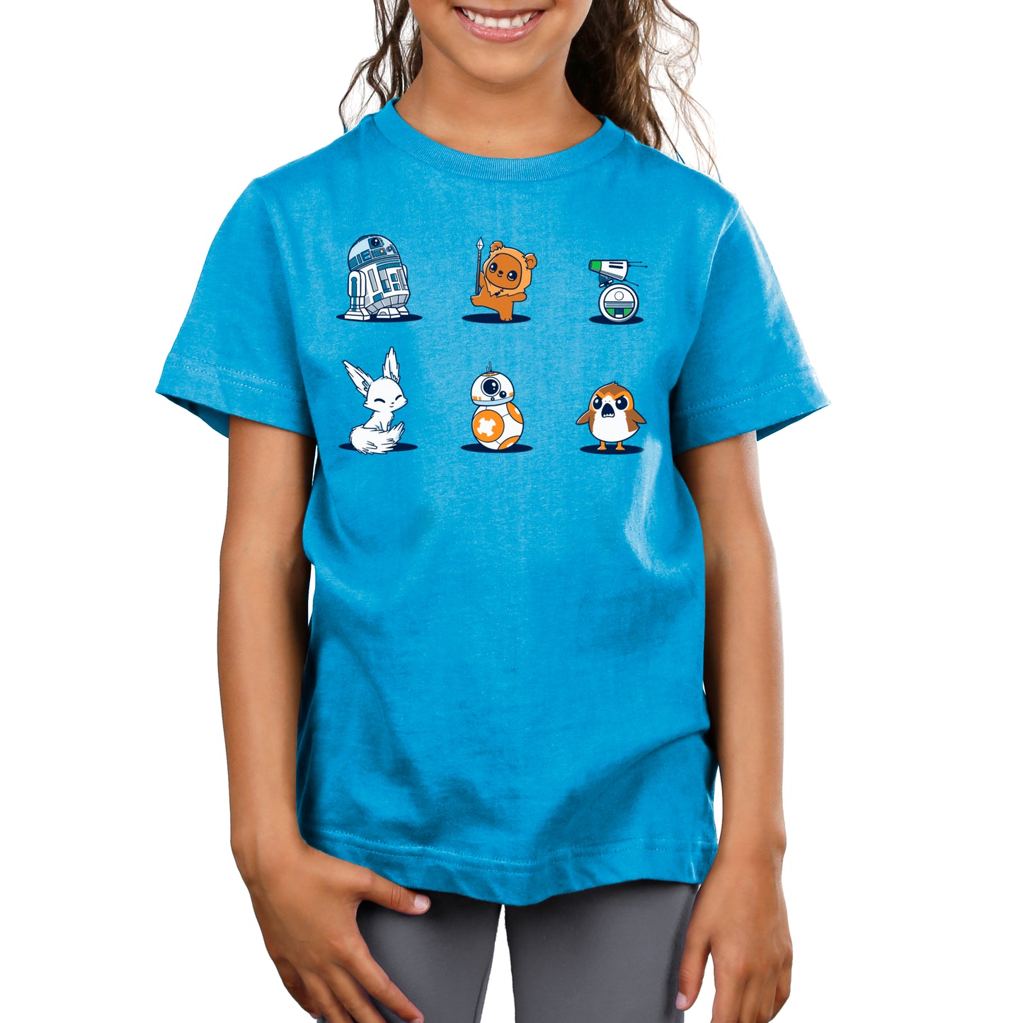 A young girl wearing a blue Star Wars Cuties t-shirt.