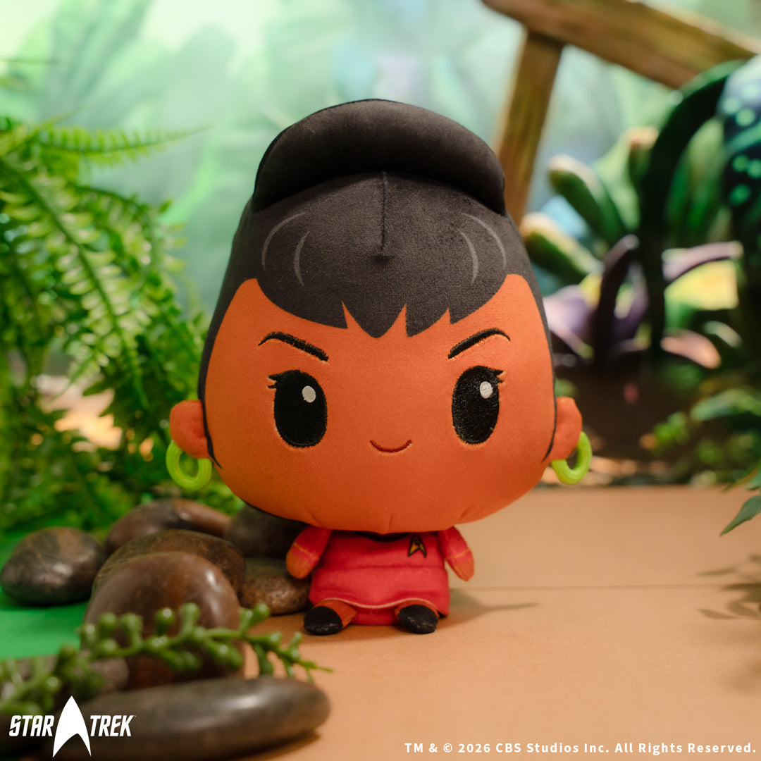 Star Trek Uhura Cloudheads plushie sitting near rocks and foliage