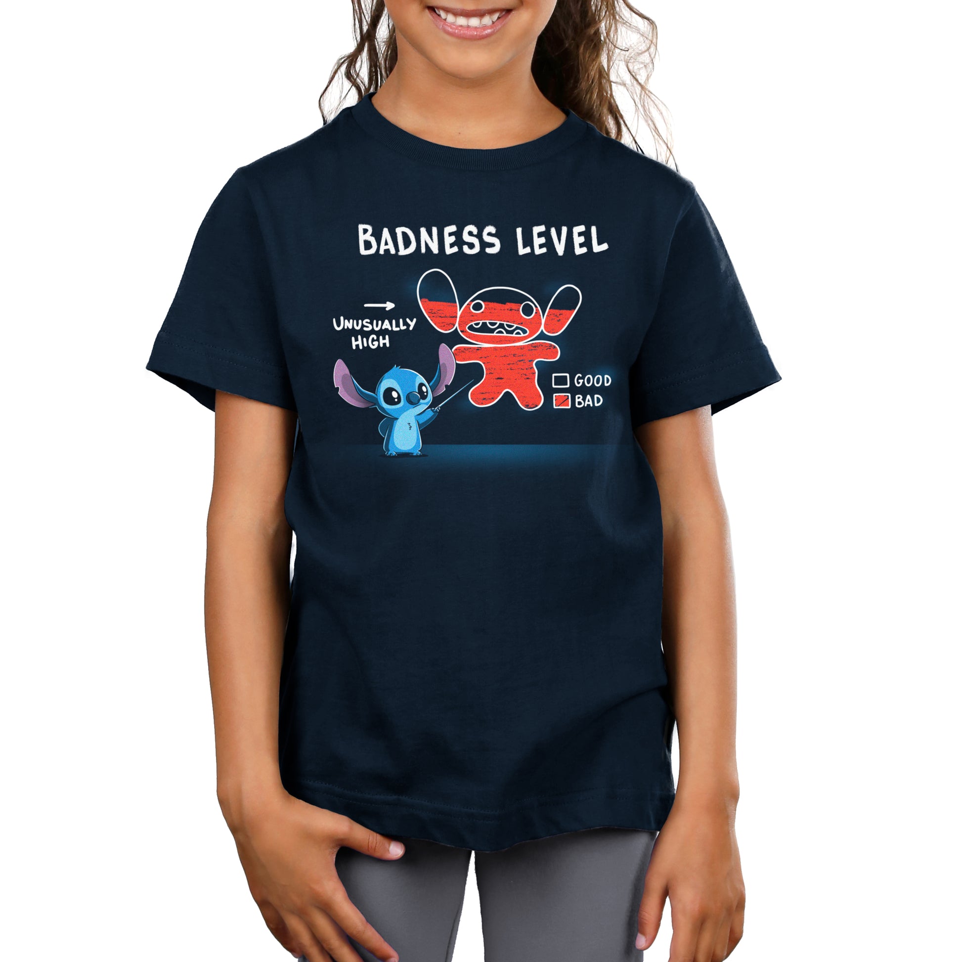 A Disney girl wearing an official licensed Disney Stitch's Badness Level t-shirt.