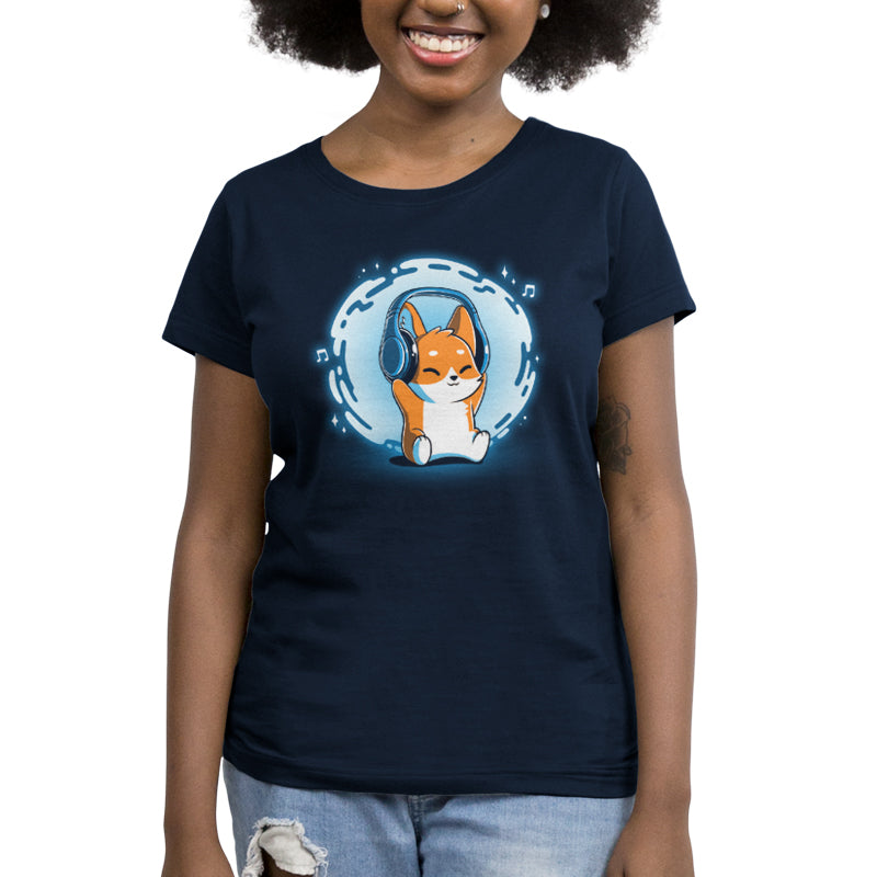 A woman wearing a Surrounded by Music (GLOW) t-shirt by TeeTurtle with an image of a corgi.