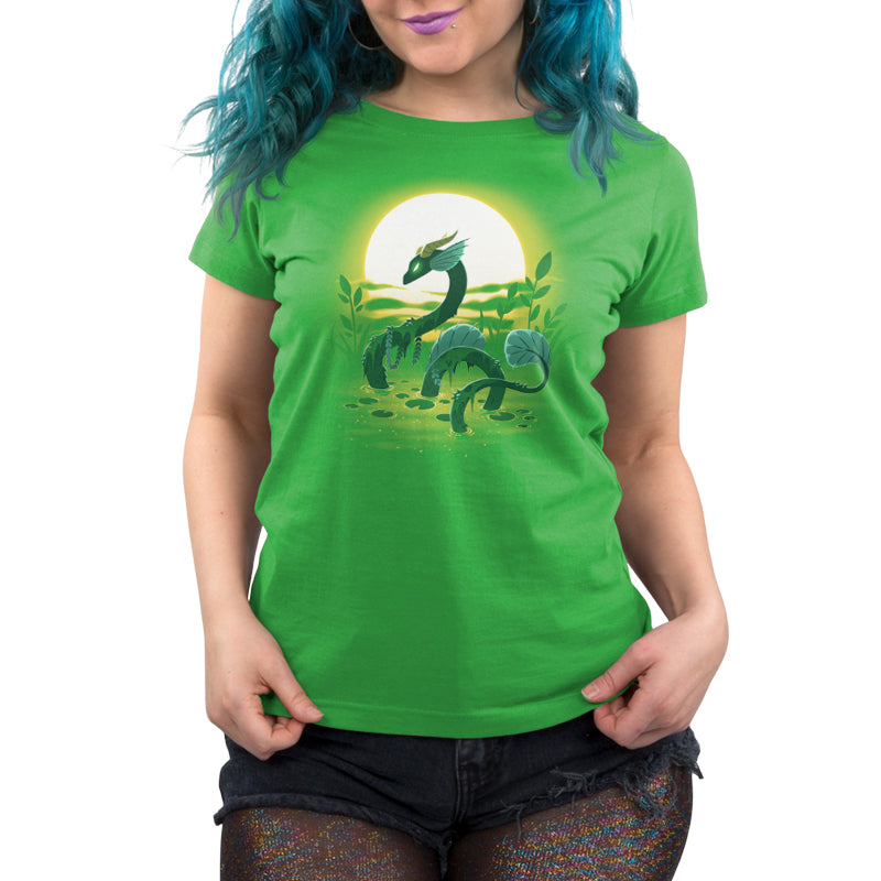 A woman wearing a TeeTurtle Swamp Dragon green t - shirt.