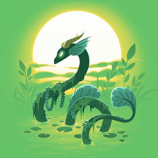 A green serpent-like dragon with glowing green eyes and a horned head emerges from the swamp, set against a bright sunlit background with surrounding foliage. The scene comes to life on the monsterdigital Swamp Dragon Tee, made of super soft ringspun cotton for ultimate comfort.