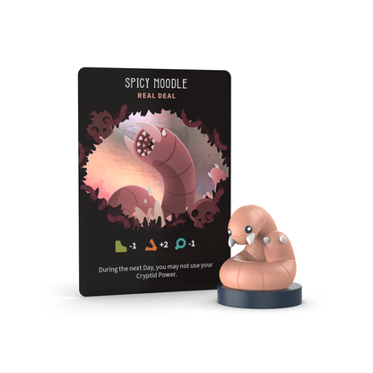 The Twisted Cryptids: Vinyl Figure Blind Box by Unstable Games includes a "Spicy Noodle" game card featuring a worm creature and a matching vinyl mini figure—perfect for collecting or adding surprise fun to your mystery blind box.