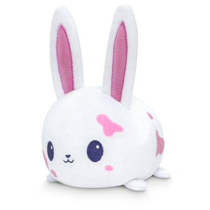 A white bunny stuffed animal with pink eyes, perfect for TeeTurtle collectors, from the Plushiverse Arts & Crafts Bunny Plushie Tote Bag.