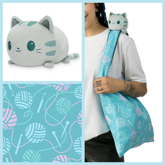 A woman is holding a TeeTurtle Plushiverse Crafty Cat Plushie Tote Bag.
