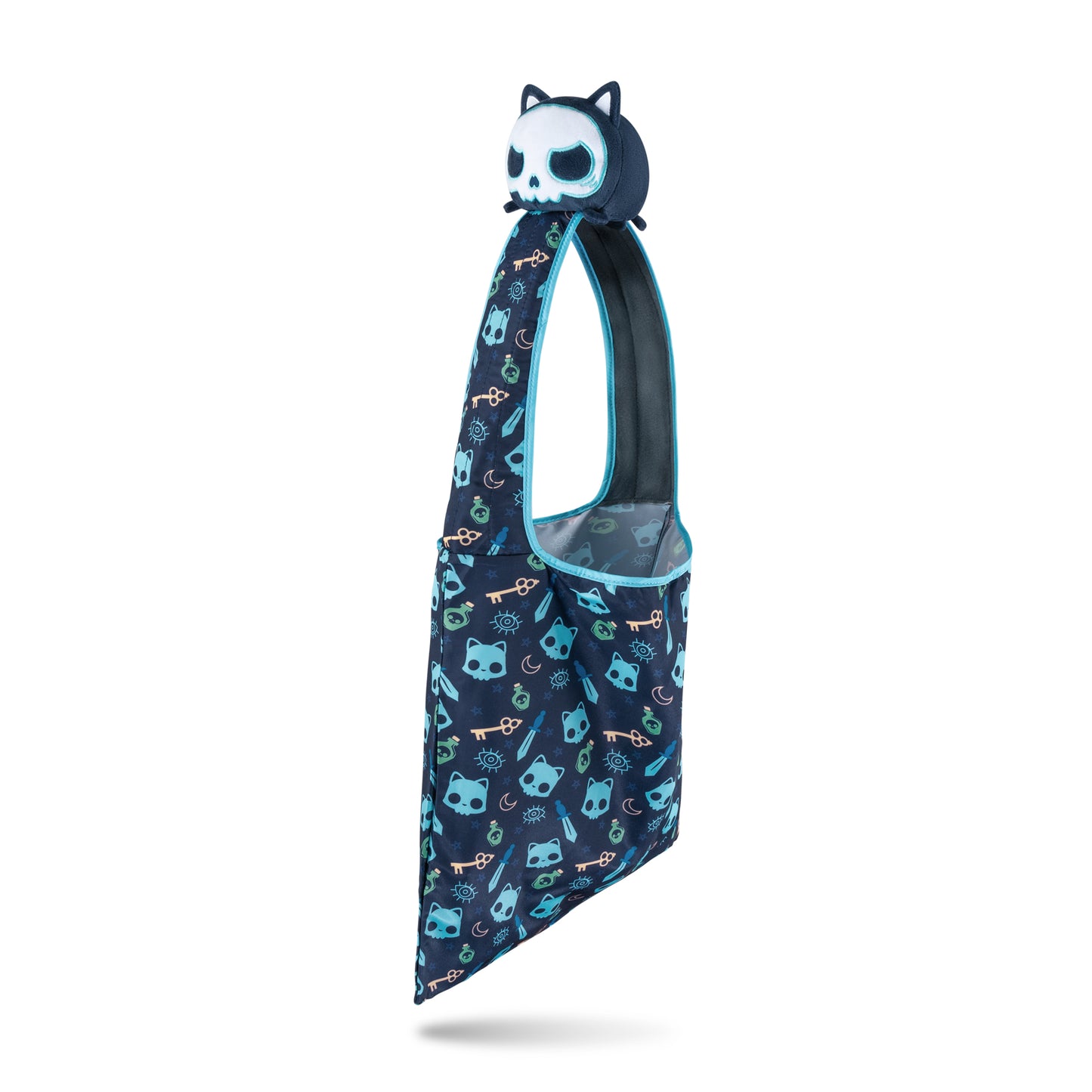 A TeeTurtle Plushiverse Skeleton Cat Plushie Tote Bag with a stuffed animal on it featuring a secret tote bag.