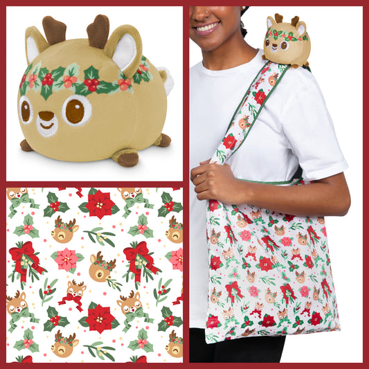 A woman is holding a Plushiverse Holly Jolly Deer Plushie Tote Bag by TeeTurtle, which may secretly carry TeeTurtle plushies.