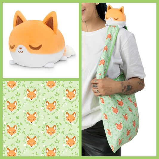 A woman is holding a TeeTurtle Plushiverse Floral Fox Plushie Tote Bag.