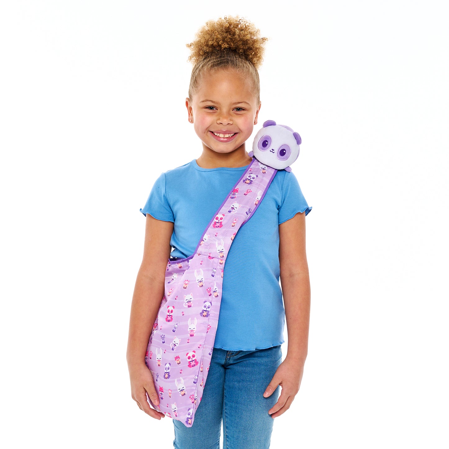 Young girl smiling with a Plushiverse Bobalicious Panda Plushie Tote Bag from TeeTurtle on her shoulder.