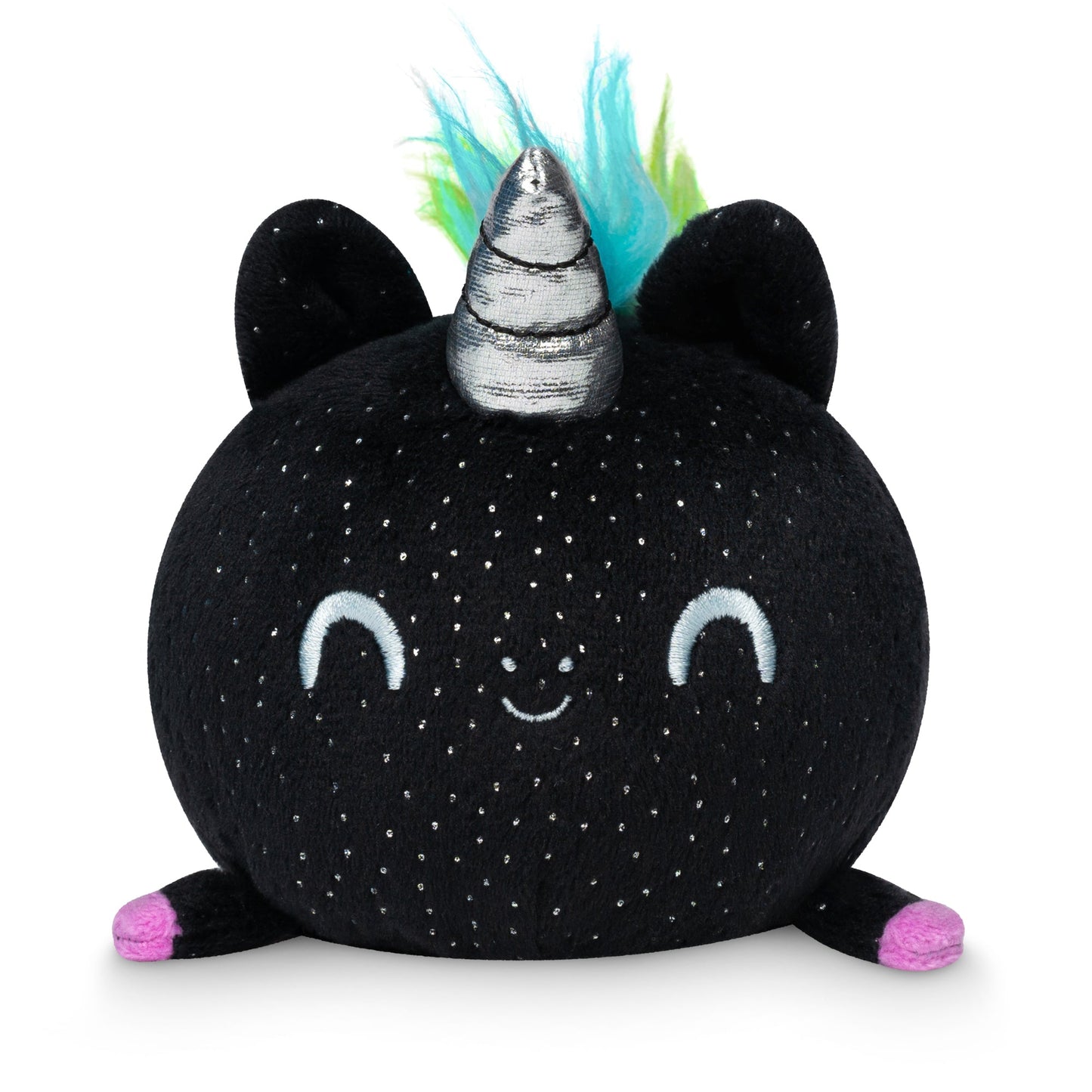 A round, black TeeTurtle Plushiverse Unicorn Pride Plushie Tote Bag with a silver horn, green and blue hair, and pink feet. The toy has large ears and a smiling face with closed eyes.