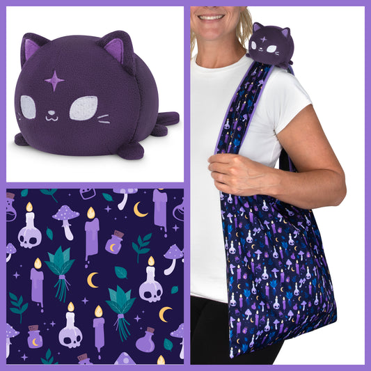 A woman is holding a Plushiverse Witchy Whiskers Cat Plushie Tote Bag by TeeTurtle, carrying necessities.