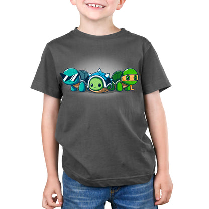 A young boy wearing a TeeTurtle tee with Cosplay Turtles on it.