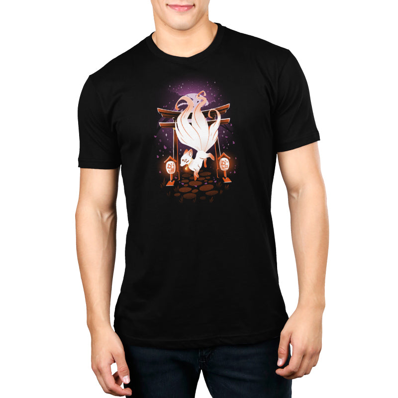 A man wearing an Enchanting Kitsune black t-shirt by TeeTurtle.