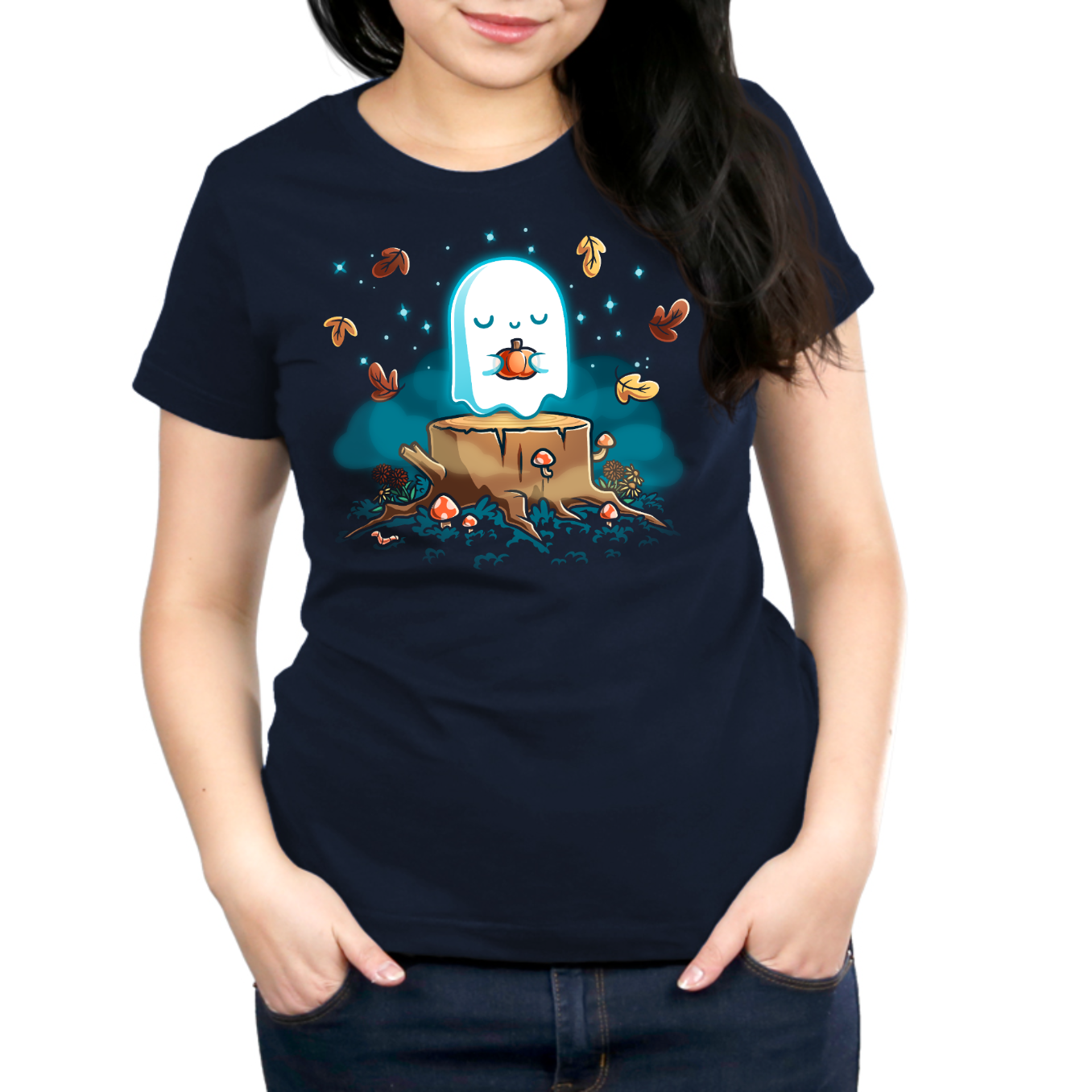 Premium Cotton T-shirt_TeeTurtle navy Autumn Apparition Premium Cotton T-shirt featuring a glowing ghost peacefully holding a pumpkin while floating above a tree stump surrounded by mushrooms, wildflowers, falling autumn leaves, and twinkling stars in a whimsical nighttime forest.