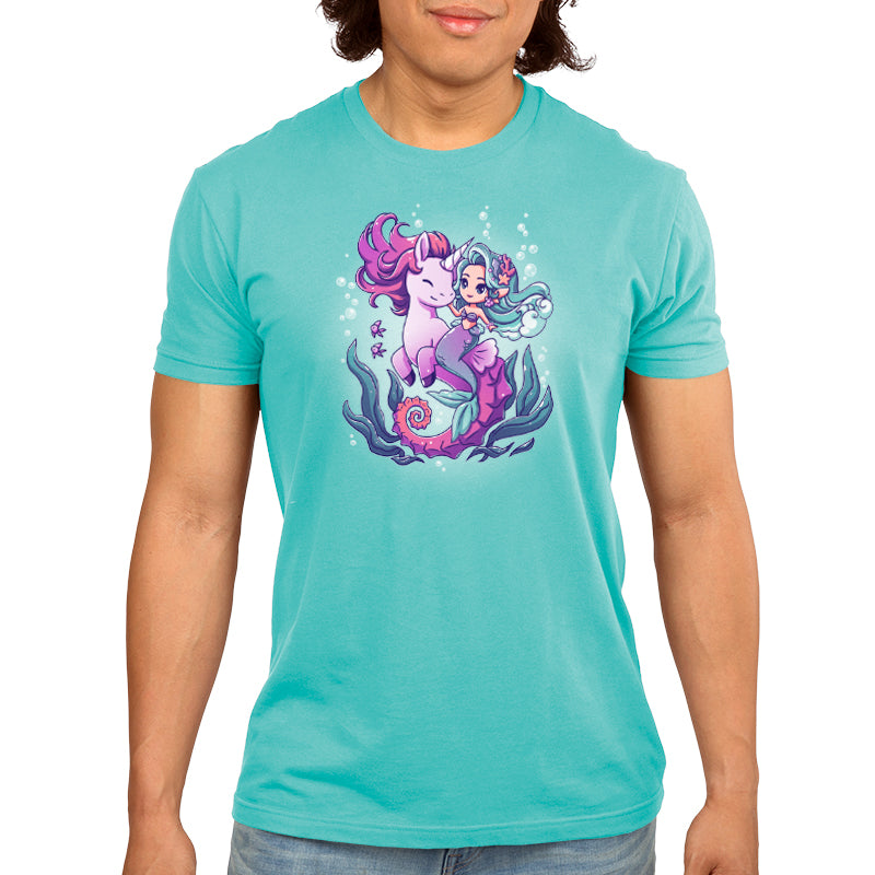 A man wearing a TeeTurtle BFFs (Sea Unicorn and Mermaid) turquoise t - shirt.