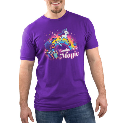 A man wearing a TeeTurtle t-shirt with the Books Are Magic (Unicorn) design on it.