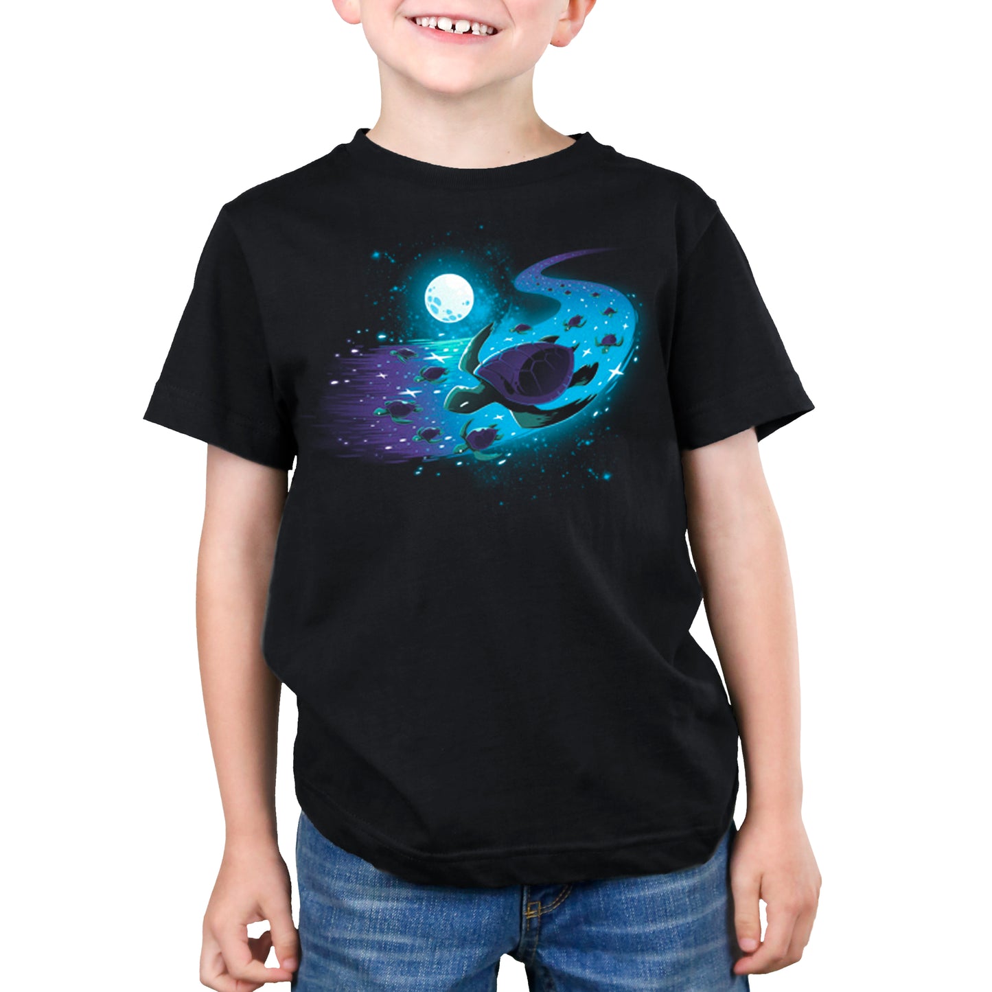 A young boy wearing a black Celestial Current t-shirt featuring a spaceship by TeeTurtle.