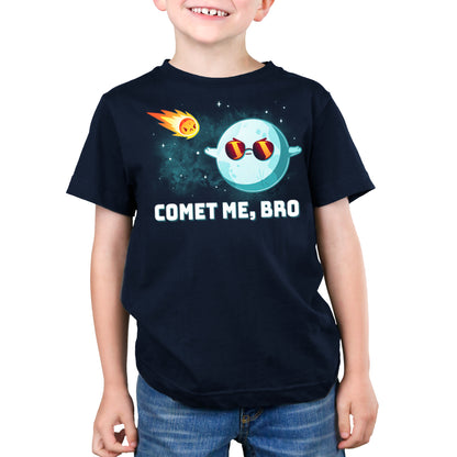 A boy wearing a navy blue t-shirt by TeeTurtle that says "Comet Me, Bro".
