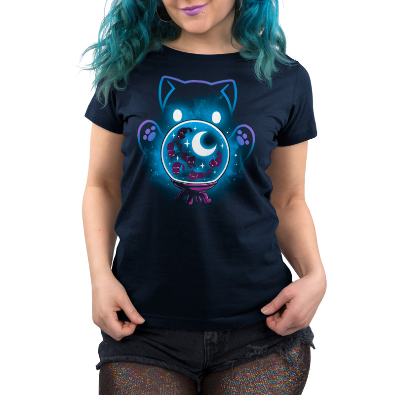 A woman wearing a navy blue Cosmic Kitty tee from TeeTurtle.
