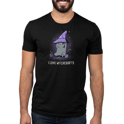 A man wearing a black Crafty Kitty t-shirt by TeeTurtle featuring the phrase "I Love Witches" shows his admiration for witchcraft.