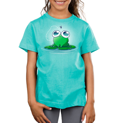 A young girl wearing an Eyes On the Prize tee by TeeTurtle.