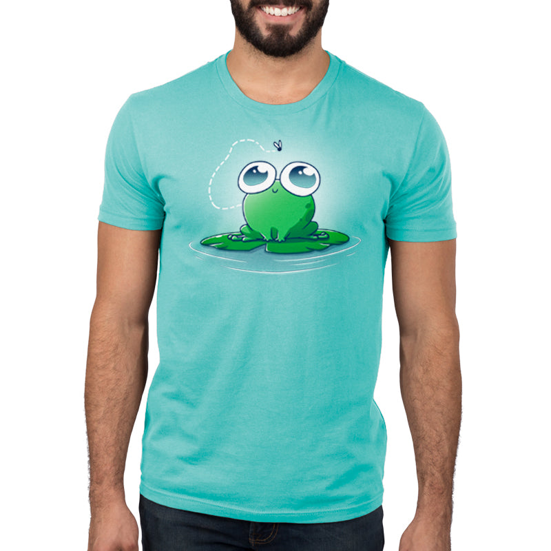 A man wearing a Eyes On the Prize Caribbean Blue casual fit frog t-shirt made of Ringspun Cotton from TeeTurtle.
