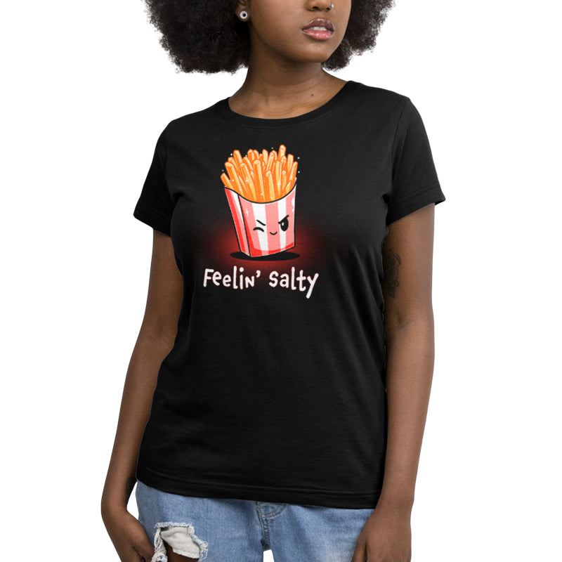 A woman wearing a black T-shirt by TeeTurtle that says "Feelin' Salty".