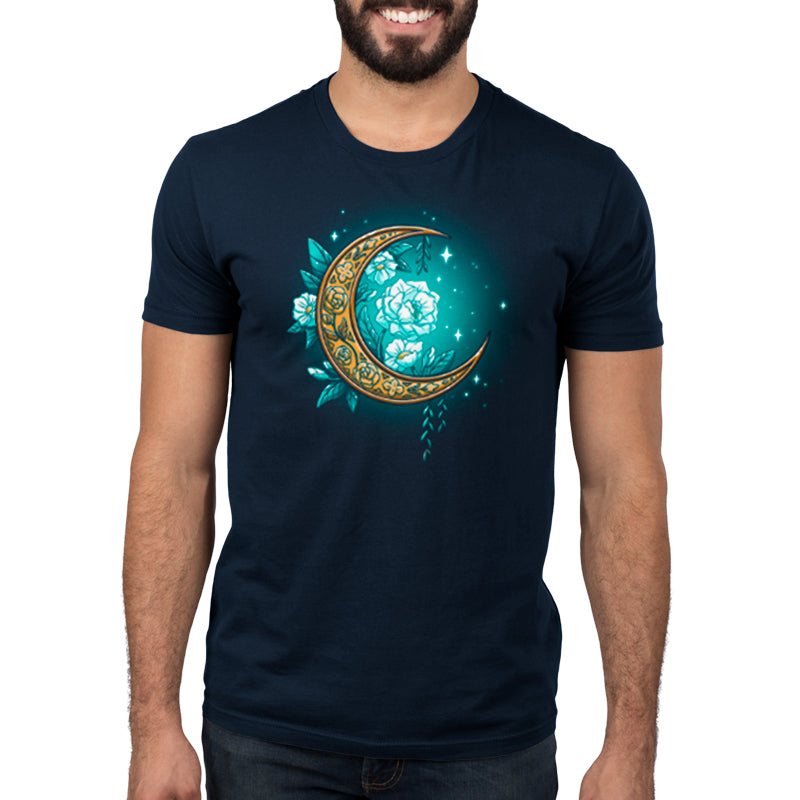 A man wearing a blue t-shirt with a Floral Moon and blossoming flowers by TeeTurtle.