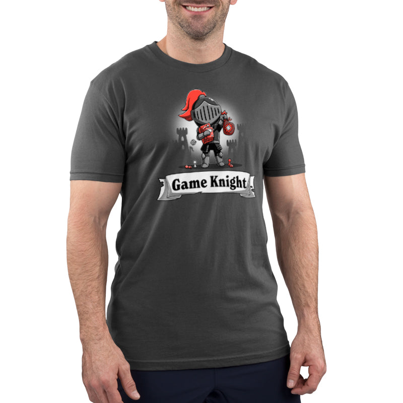 A man wearing a charcoal gray TeeTurtle T-shirt with the words "Game Knight" on it.