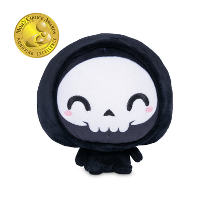 Cloudheads: 5" Grim Reaper (Grim) - A black hooded plush grim reaper with a white skull face, black embroidered eyes and mouth, and small pink cheeks, shown on a plain white background. A gold Mom's Choice Awards badge appears in the top-left corner.