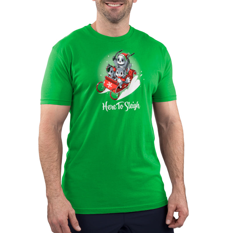 A man wearing a TeeTurtle "Here to Sleigh" t-shirt depicting a Santa Claus riding a sleigh.