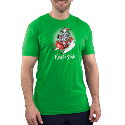 A man wearing a TeeTurtle "Here to Sleigh" t-shirt depicting a Santa Claus riding a sleigh.