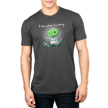A man wearing a gray "I Dino What I'm Doing" t-shirt from TeeTurtle.