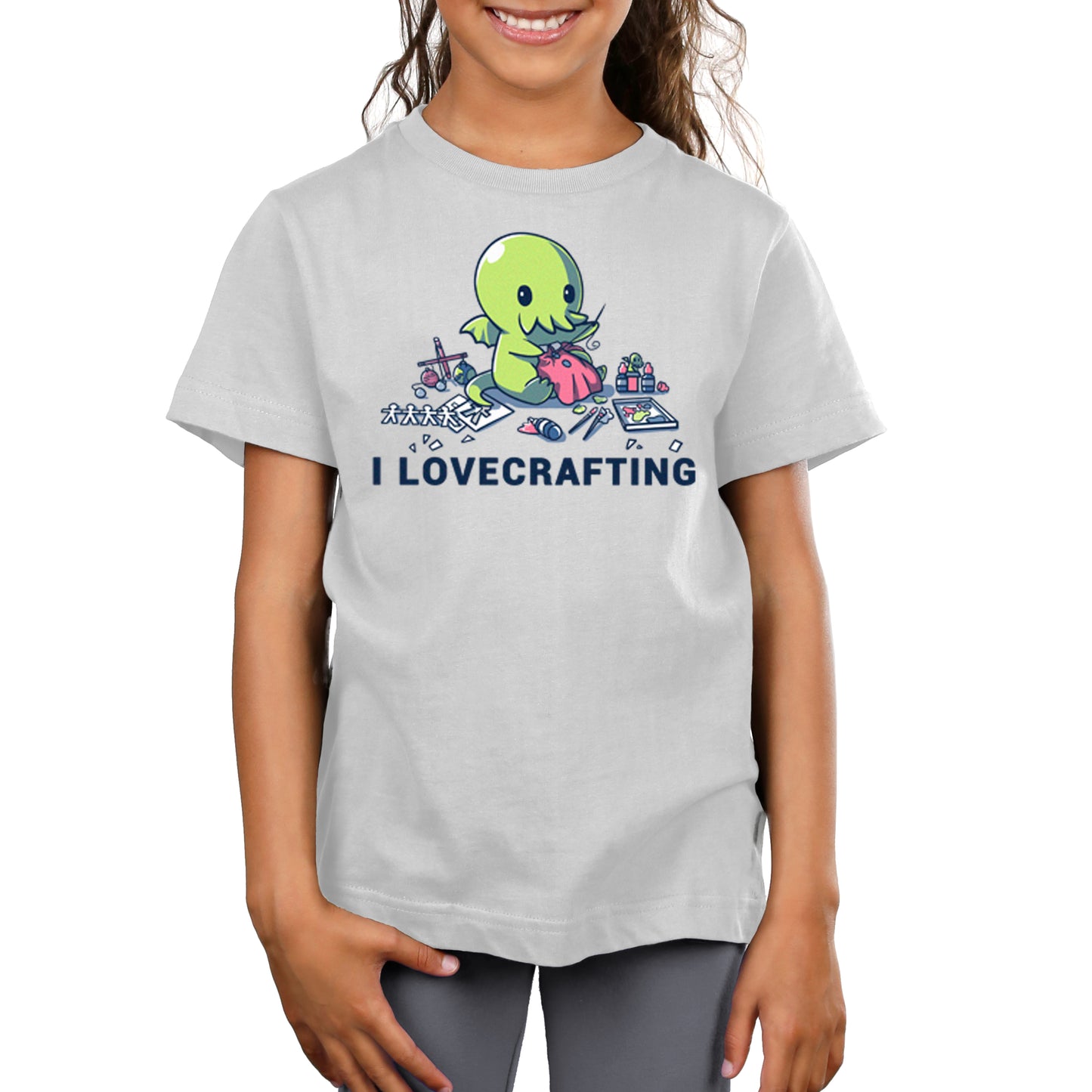 A girl wearing a TeeTurtle t-shirt that says "I Lovecrafting".