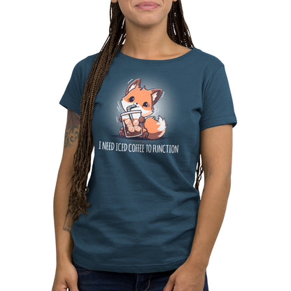 A woman wearing a blue t-shirt with a fox on it from TeeTurtle called "I Need Iced Coffee To Function.