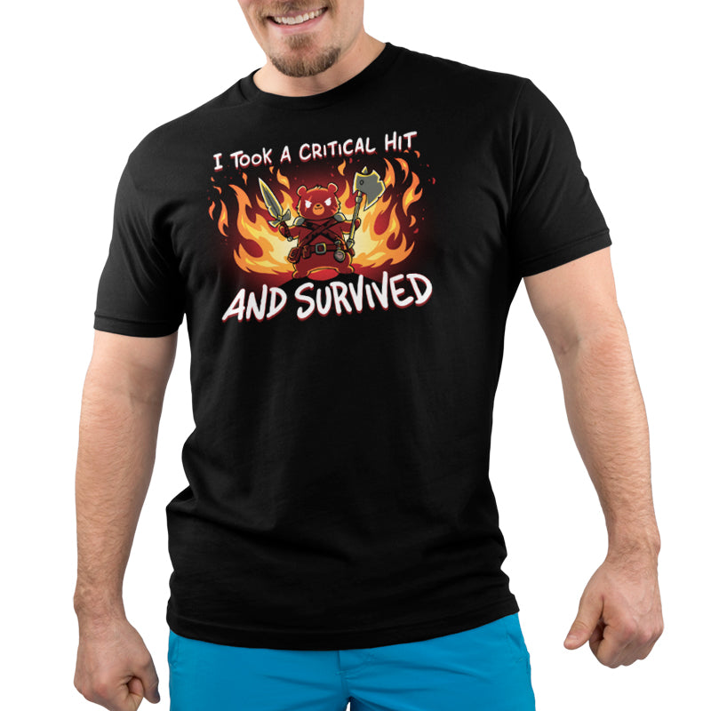 A man wearing a black t-shirt that says "I Took A Critical Hit and Survived" from TeeTurtle.