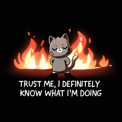 Men's Premium T-Shirt_TeeTurtle black I Definitely Know What I'm Doing Men's Premium T-Shirt featuring a smug gray cat standing confidently in front of bright flames with the text "Trust Me, I Definitely Know What I'm Doing."