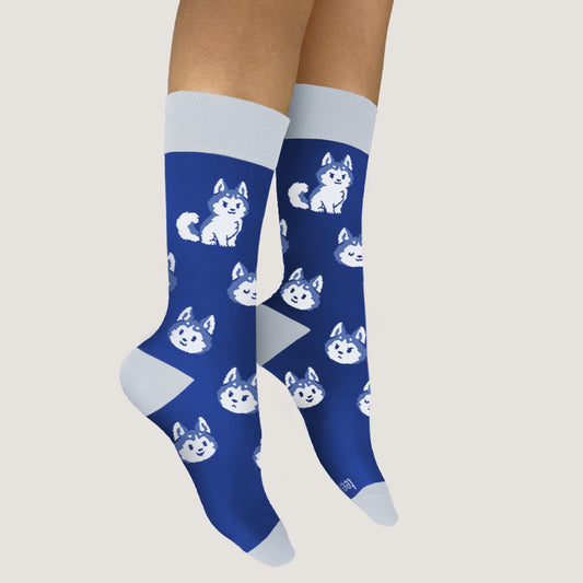 A pair of comfortable I'm Just A Little Husky socks with cute white cats on them by TeeTurtle.
