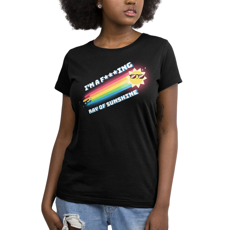 A woman wearing a comfortable and casual black t-shirt with the brand name "TeeTurtle" and the product name "I'm a F***ing Ray of Sunshine" on it.