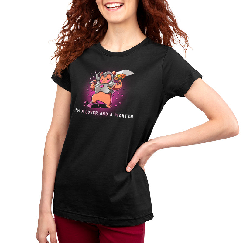A woman wearing a black T-shirt from TeeTurtle that says "I'm a Lover and a Fighter" showcases her love for gaming.