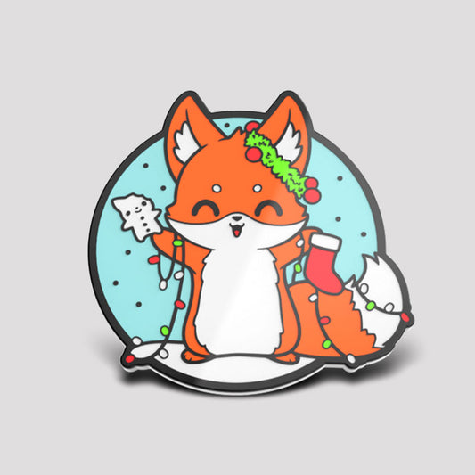 A cute fox with a Christmas hat on the TeeTurtle It's That Time of Year Pin.