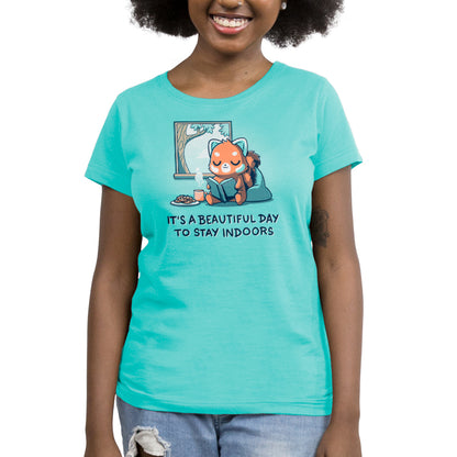 A woman wearing a caribbean blue t-shirt that says "It's a Beautiful Day to Stay Indoors" by TeeTurtle.