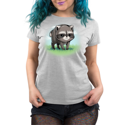 Premium Cotton T-shirt_TeeTurtle silver The Little Round Raccoon Premium Cotton T-shirt featuring a cute illustration of Jimothy, a raccoon with a short spine who gained internet fame for his unusual looks. He's smiling and you can see a little bit of the grass under him and the sky behind him. 