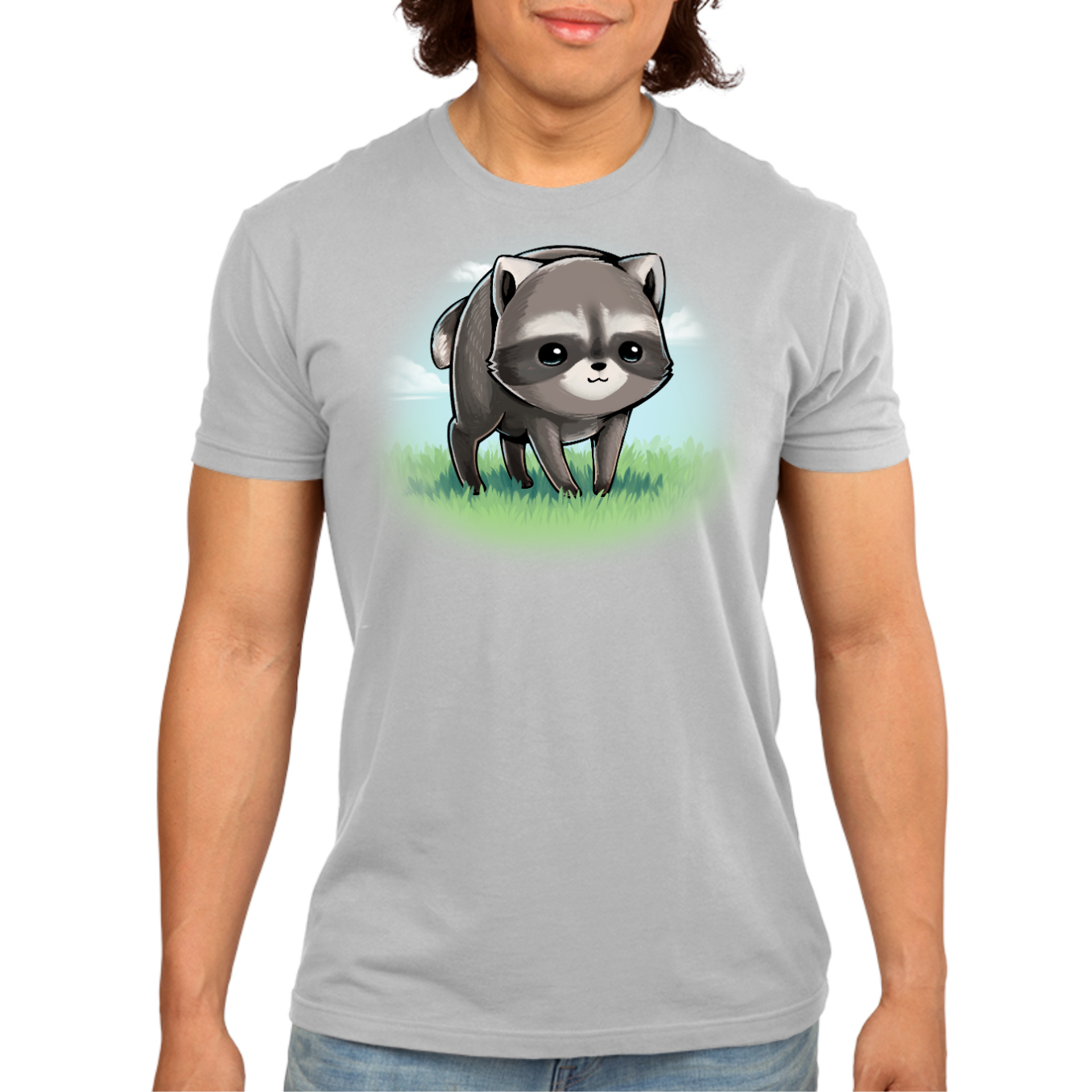 Premium Cotton T-shirt_TeeTurtle silver The Little Round Raccoon Premium Cotton T-shirt featuring a cute illustration of Jimothy, a raccoon with a short spine who gained internet fame for his unusual looks. He's smiling and you can see a little bit of the grass under him and the sky behind him. 