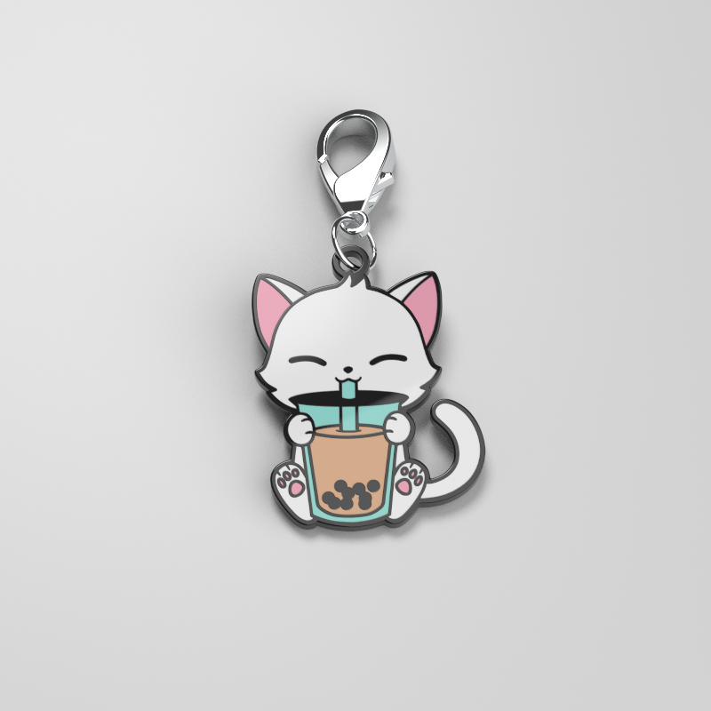 A Boba Cat Enamel Keychain by TeeTurtle, featuring a cat with a cup of coffee, adding personal style.