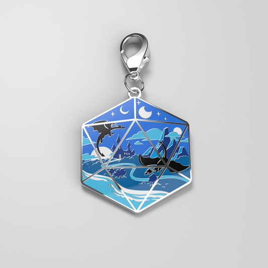 A D20 Landscape Enamel Keychain with an image of a whale in the ocean. Perfect as a TeeTurtle Enamel Keychain or to clip onto any item with the metal clip.