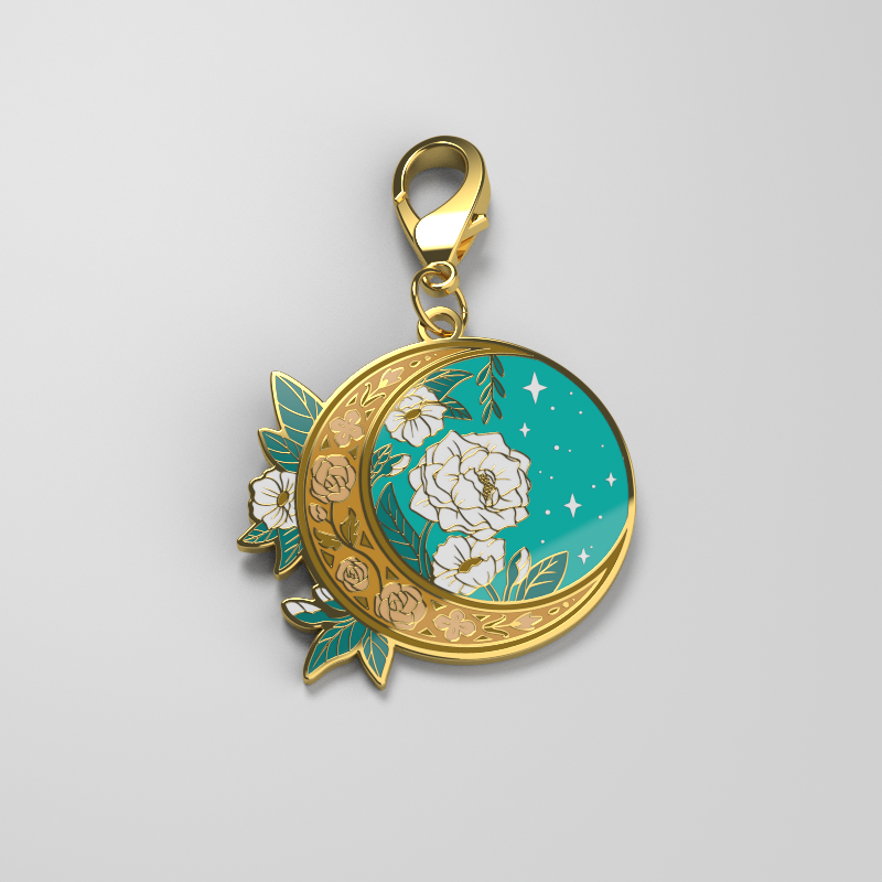 A TeeTurtle Floral Moon Enamel Keychain, perfect for expressing personal style with a touch of the night sky.